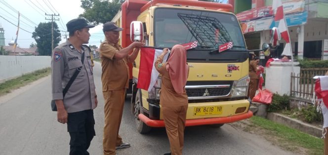 
					Polsek Bosar Maligas Sukseskan Pembagian Bendera Merah Putih, Wujud Profesionalisme Polri Jelang HUT RI Ke-80